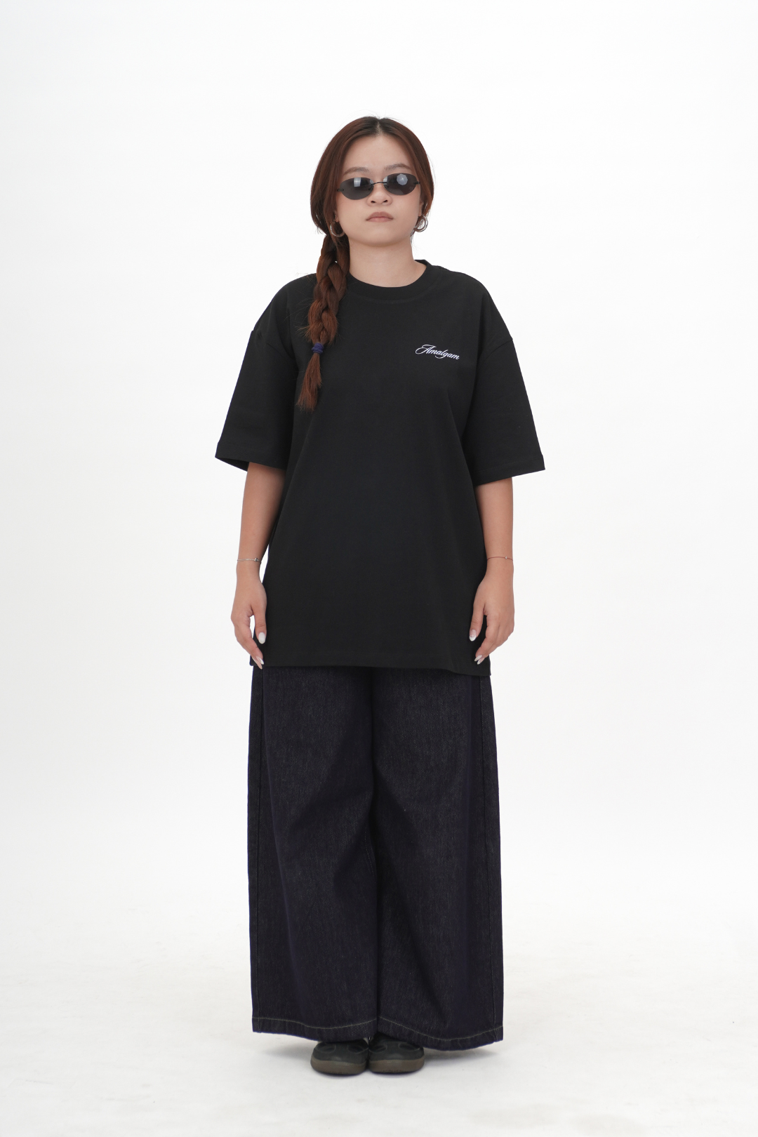 Person wearing a black oversized t-shirt and wide-leg pants on a white background
Black Graphic Tee Cars Overdrive Tee Amalgam Amalgam.store Oversized