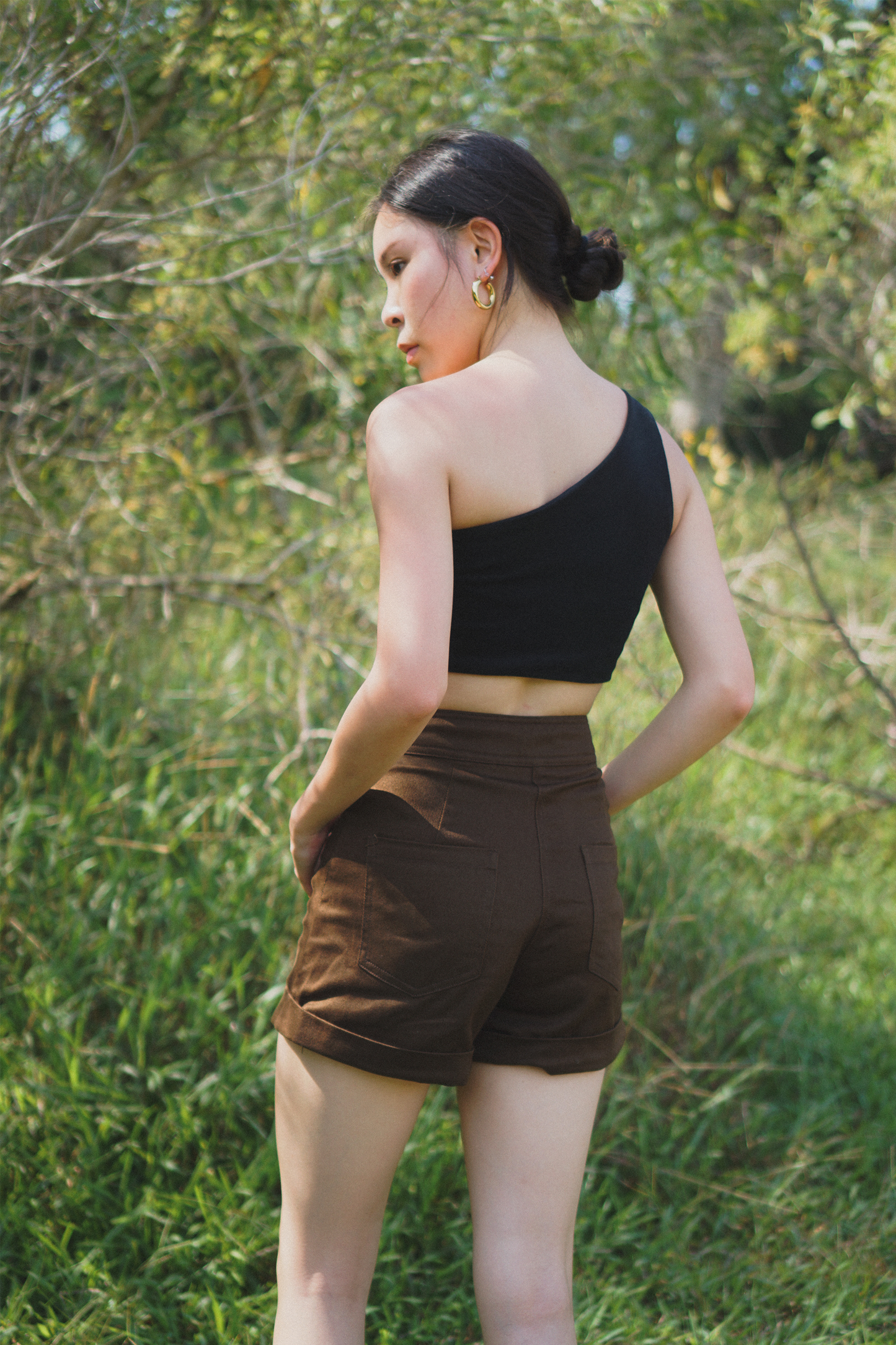 Amalgam Black toga top soft fabric atheleisure look with brown chocolate tailored shorts made from cotton for everyday wear fitted casual and structured with pockets and buttton loops as well as hook and pockets