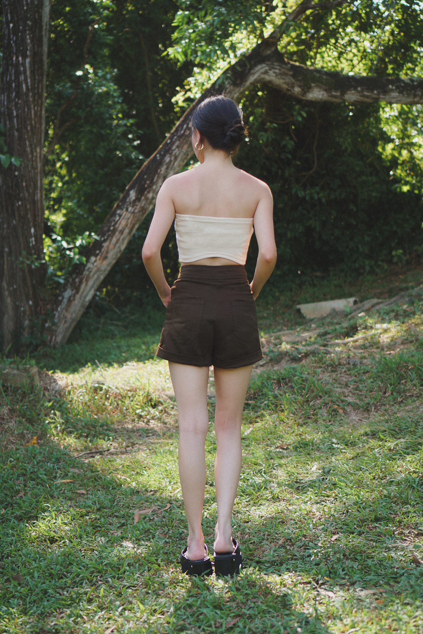 Amalgam bisque curve back tube with panelled design in the front and curve up design on the back of tube flattering but fitting to make you look skinnier sizes runs bigger with brown chocolate tailored shorts made from cotton for everyday wear fitted casual and structured with pockets and buttton loops as well as hook and pockets