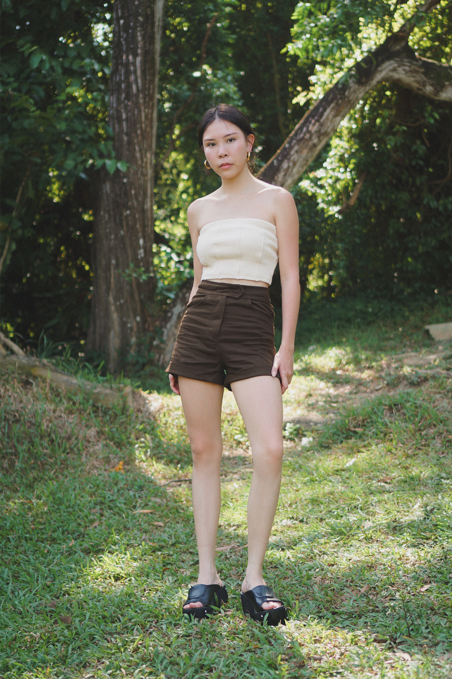 Amalgam bisque curve back tube with panelled design in the front and curve up design on the back of tube flattering but fitting to make you look skinnier sizes runs bigger with brown chocolate tailored shorts made from cotton for everyday wear fitted casual and structured with pockets and buttton loops as well as hook and pockets