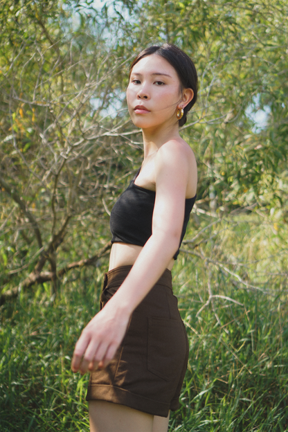 Amalgam Black toga top soft fabric atheleisure look with brown chocolate tailored shorts made from cotton for everyday wear fitted casual and structured with pockets and buttton loops as well as hook and pockets
