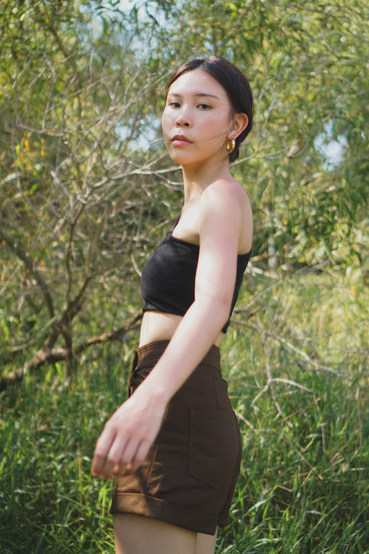 Amalgam Black toga top soft fabric atheleisure look with brown chocolate tailored shorts made from cotton for everyday wear fitted casual and structured with pockets and buttton loops as well as hook and pockets