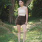 Amalgam bisque curve back tube with panelled design in the front and curve up design on the back of tube flattering but fitting to make you look skinnier sizes runs bigger with brown chocolate tailored shorts made from cotton for everyday wear fitted casual and structured with pockets and buttton loops as well as hook and pockets